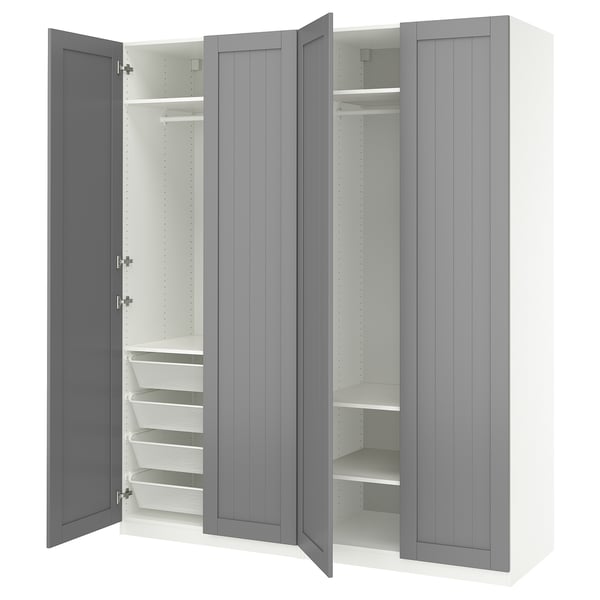 A grey ikea PAX wardrobe with open doors, revealing shelves and baskets.