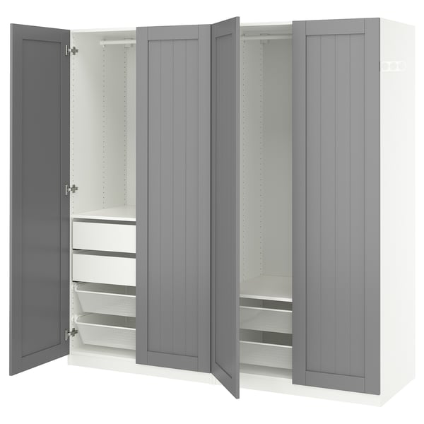 A grey ikea PAX wardrobe with open doors, revealing shelves and storage solutions.