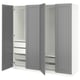 A grey ikea PAX wardrobe with open doors, revealing shelves and storage solutions.