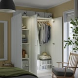 White wardrobe with clothes, towels, adjustable feet & lighting