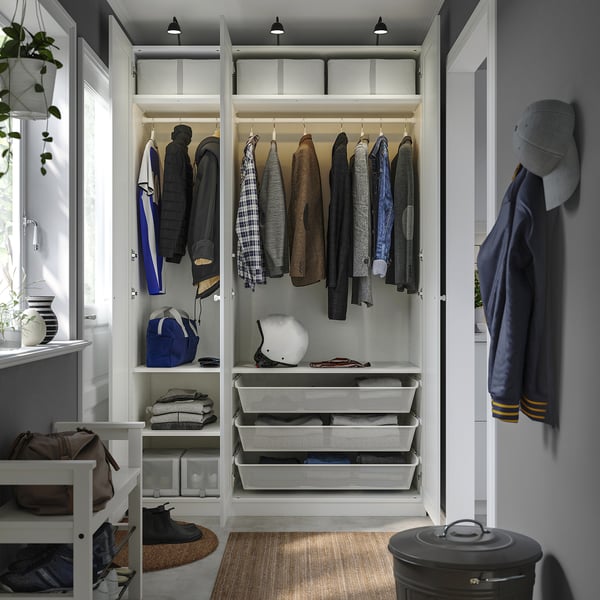 Organized closet with hanging garments, drawers for folded clothes, and storage shelves.