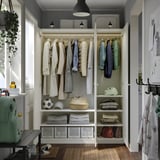 Organized closet with clothes, shelves, and storage bins; adjustable feet for floor leveling.
