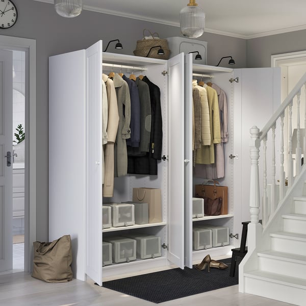 Modern closet organizer with storage boxes, hangers, and shelves. Adaptable interior; includes mesh basket.