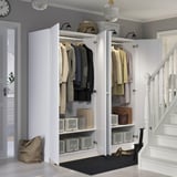 Modern closet organizer with storage boxes, hangers, and shelves. Adaptable interior; includes mesh basket.