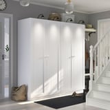 PAX white wardrobe, modern, large, fits entryway, includes shelves and hooks, with stairs nearby.