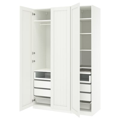 A white ikea PAX wardrobe with open doors, displaying shelves and drawers.