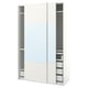 White PAX closet, sliding mirrored doors, glass shelves, metal rails.