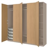 Depicts a light brown PAX wardrobe with open doors. It shelves and drawers for storage.