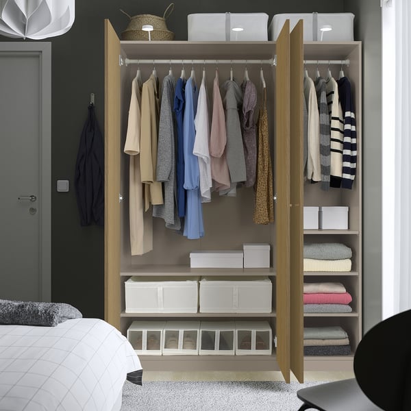 Wardrobe with clothes and bed; wooden, open