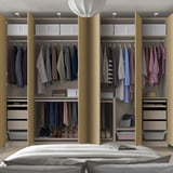 Well-organized walk-in wardrobe with clothes hangers, shelves, and storage boxes. Soft-closing doors and adjustable compartments.