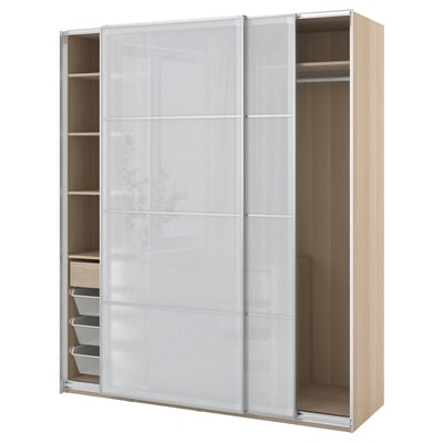 A light-colored PAX wardrobe with sliding frosted-glass doors and internal shelves, drawers, and compartments for storage.