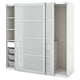 A white ikea PAX wardrobe with frosted glass doors, sliding design, and mesh baskets for storage.
