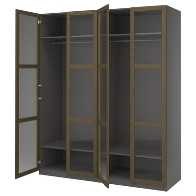 An open gray ikea PAX wardrobe with glass doors and wooden frames, featuring multiple shelves inside.