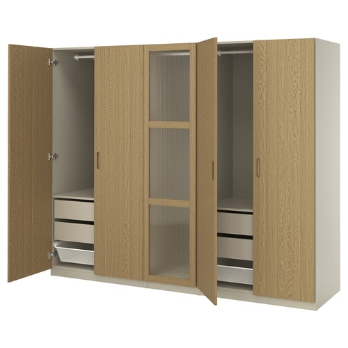 Wooden wardrobe PAX in oak color with metal handles, featuring two open sections.
