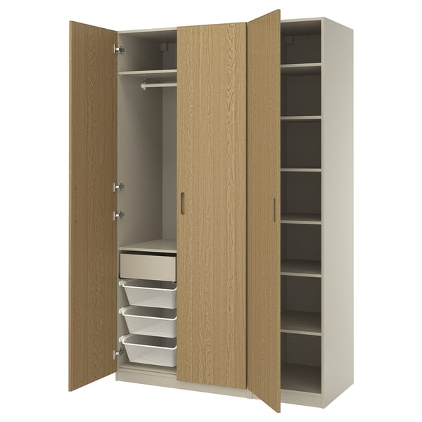 PAX wardrobe in light wood with mesh baskets, drawers, and adjustable shelves. Showing open doors, space-saving design.