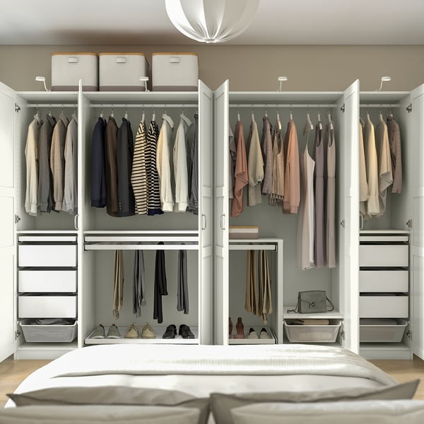 Modern bedroom with open wardrobe, clothes, drawers, and dampened hinges