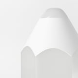 Modern sleek lamp with clean lines, smooth white surfaces, and rounded top reflecting quality design and safety.
