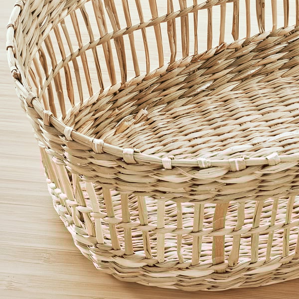 Wicker basket close-up, expertly woven with natural sedge, showcasing intricate craftsmanship, ideal for storing cutlery.