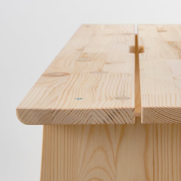 Light wood bench with simple design, smooth edges, and visible wood grain texture.