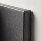 Close-up of a canvas picture frame corner showing high-quality texture and craftsmanship.