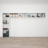 Wall-mounted storage unit, evenly organizing various items like folded clothes, books, and hat. Neatly arranged for efficient use of space.