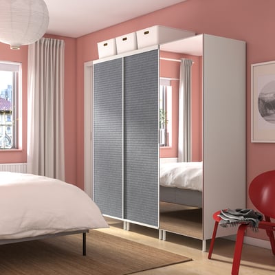 Gray PLATSA wardrobe with mirrors, floor-to-ceiling, in pink room.