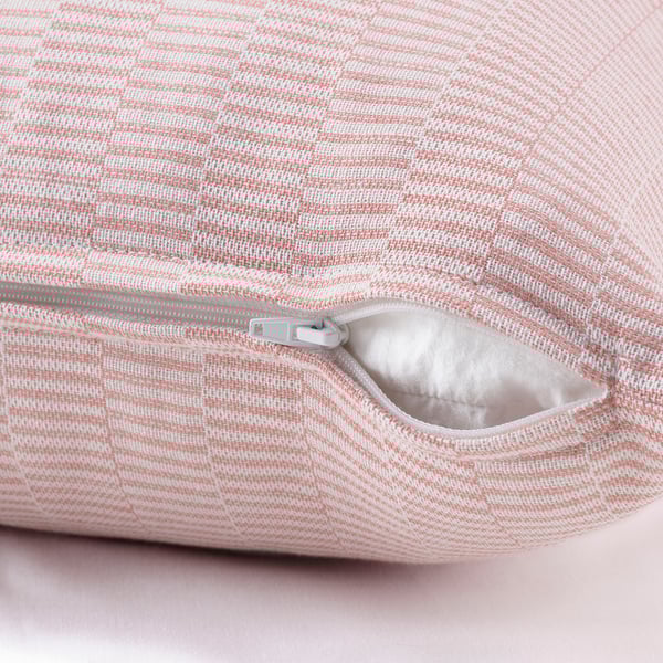 Hidden zipper on red/offwhite cotton cushion cover, easy to remove.