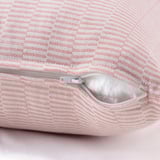 Hidden zipper on red/offwhite cotton cushion cover, easy to remove.