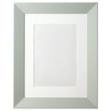 Green PLOMMONTRÄD picture frame: wide, robust design with front plastic protection, fiberboard material, stands or hangs vertically/horizontally.