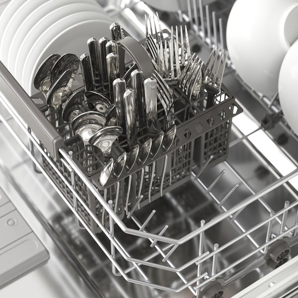 Dishwasher with silverware baskets, holding forks, spoons, and knives.