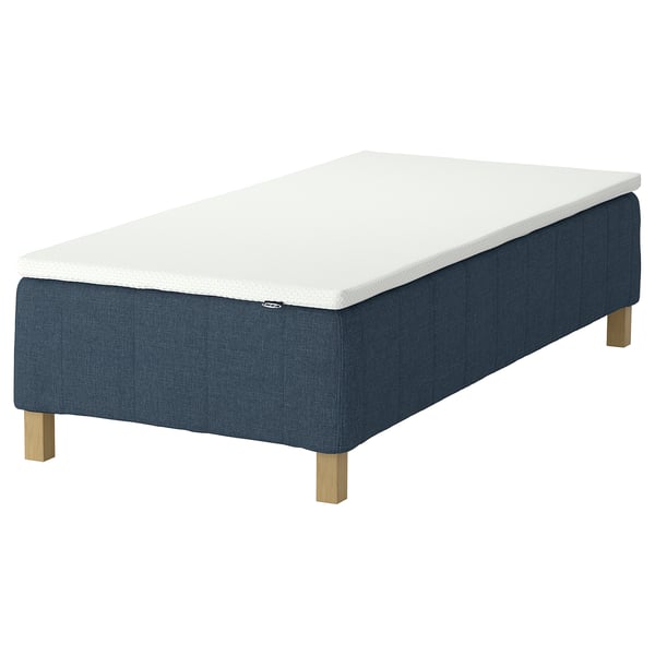 RÅHOLMAR bed: dark blue, rectangular, upholstered with wooden legs, white mattress.