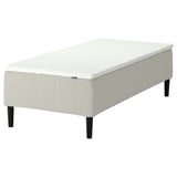 RÅHOLMAR white bed base, upholstered, rectangular, four black legs.