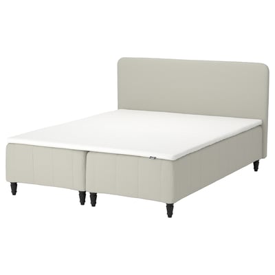 Modern bed with beige upholstered headboard and base, featuring 5 comfort zones for spine alignment.