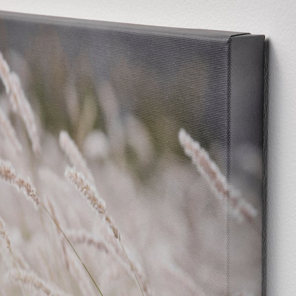 Close-up of a RAMHÄLL wall art corner, showing detailed stitching and fabric texture.