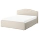 A beige RAMNEFJÄLL upholstered bed with a curved headboard, piped edges, and a soft, removable cover.