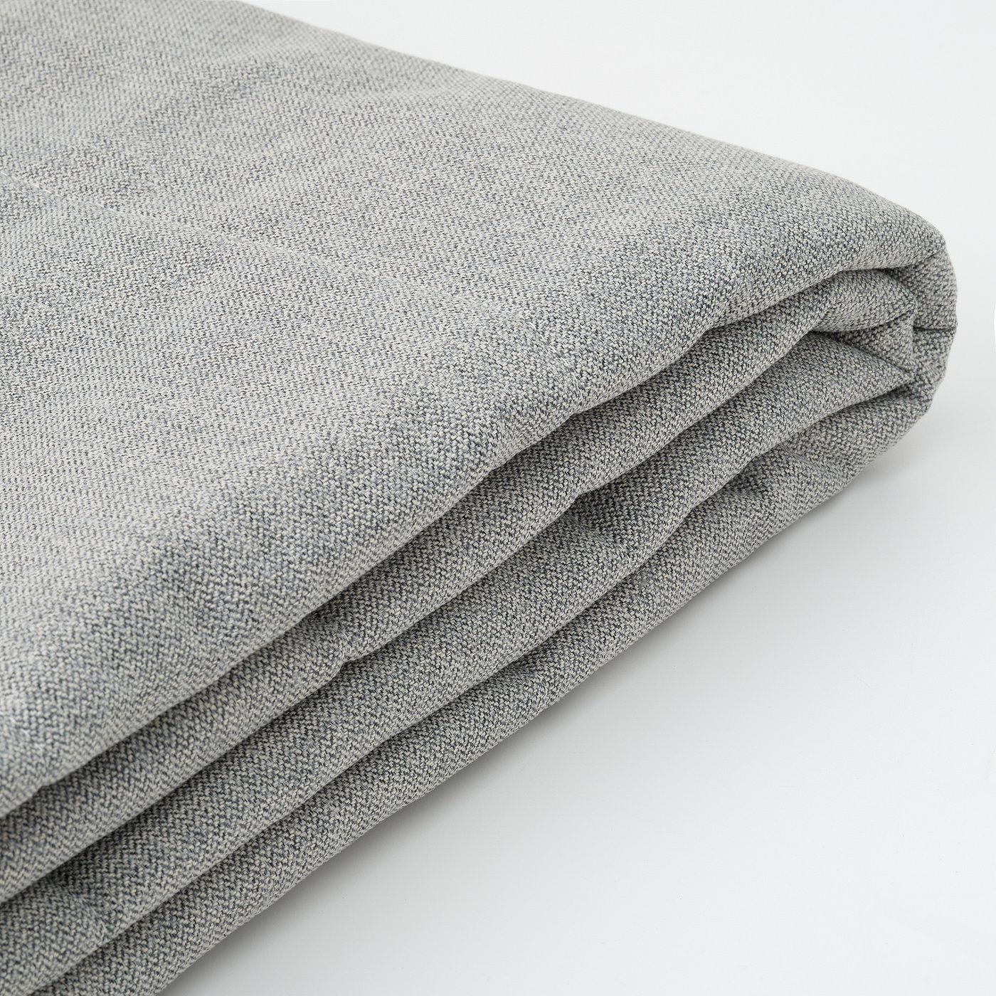 Folded grey recycled polyester fabric close-up, showing soft texture and stitching detail.