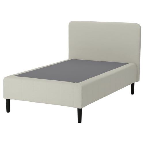 Depicts the RENFJÄLLET bed frame. Its cream-colored with black legs, designed for easy assembly and comfort.