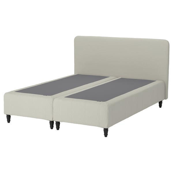 A RENFJÄLLET bed with a beige headboard, upholstered frame, and grey mattress. It footboard, pocket springs, and black legs.