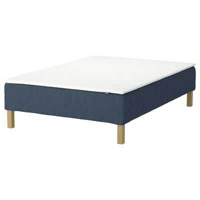 A blue RENFJÄLLET bed base with a white mattress, featuring wooden legs and a modern design.