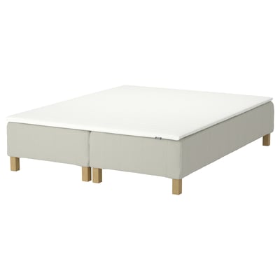 White RENFJÄLLET mattress with wooden legs.