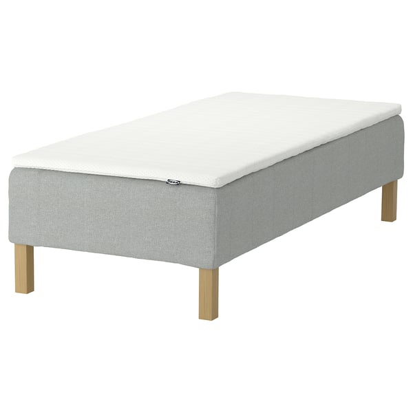 RENFJÄLLET mattress in light gray and white, rectangular with wooden legs.