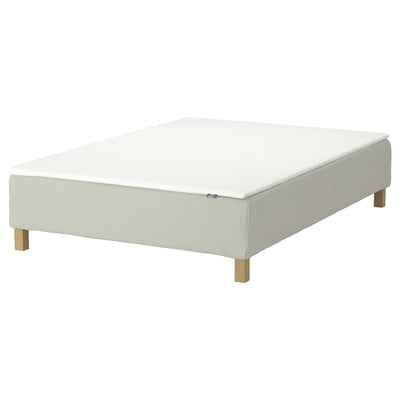 An off-white RENFJÄLLET mattress with wooden legs, featuring a supportive pocket spring core and removable, machine-washable cover.