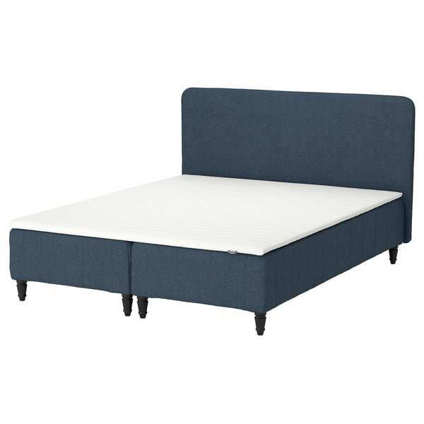 Blue RENFJÄLLET bed. Headboard, white mattress, dark wooden legs.