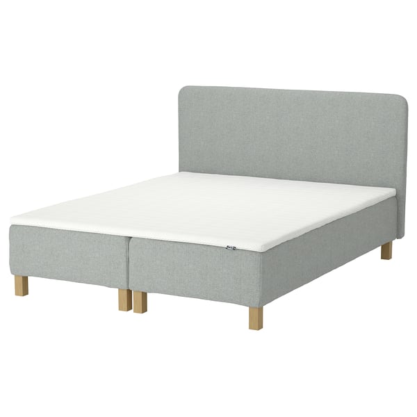 Modern bed, light grey, soft headboard, wooden legs, comfortable design.
