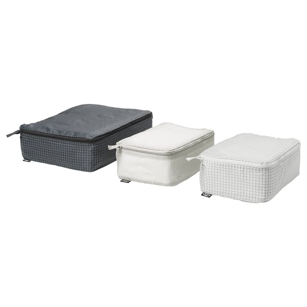 Three rectangular packing cubes in black and white grid pattern, ideal for organized travel.