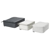 Three rectangular packing cubes in black and white grid pattern, ideal for organized travel.
