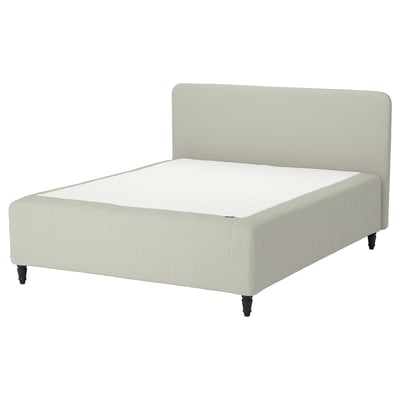 RISHÖJDEN bed in beige with upholstered headboard, rectangular shape, wooden feet.