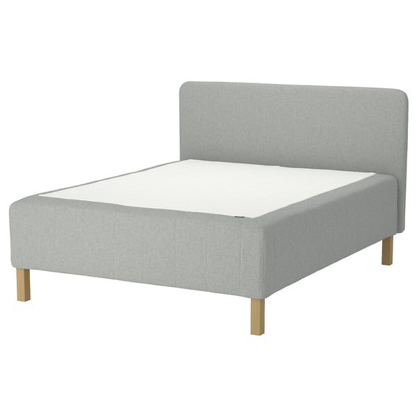Light grey RISHÖJDEN bed with wooden legs and upholstered headboard.