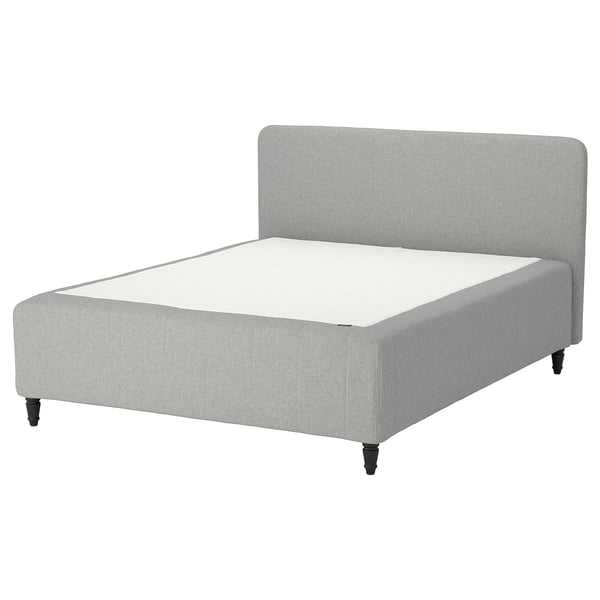 Modern grey bed, upholstered with light fabric, four black legs, curved headboard.