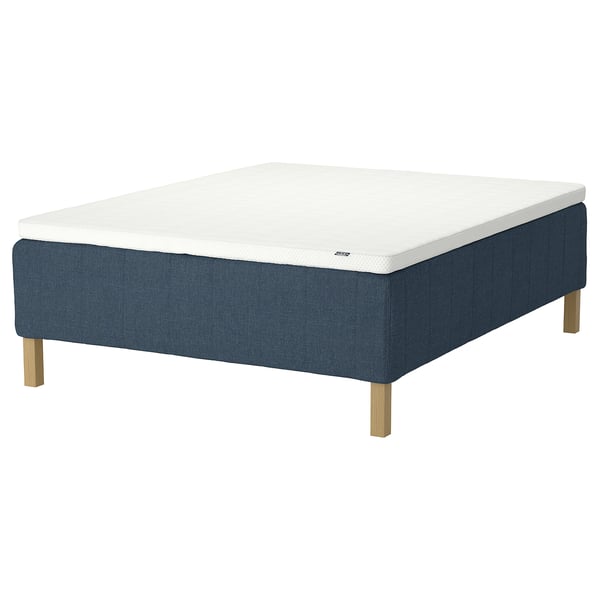 RISHÖJDEN mattress: white top, dark blue base, wooden legs, firm support.